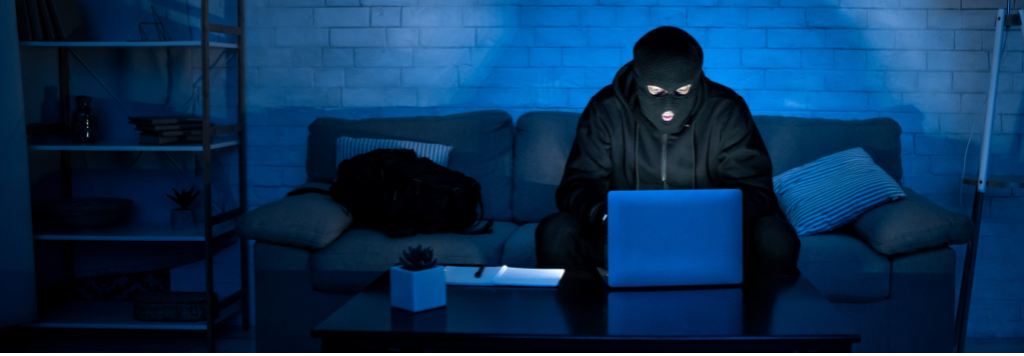AI phishing attack illustration showing hacker in dark lighting